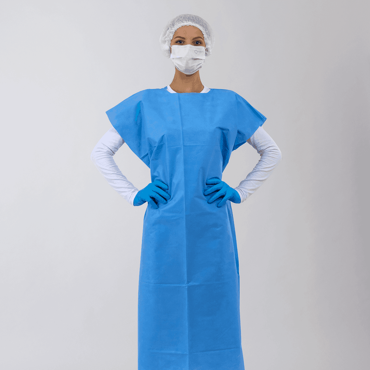 Avental SS 50 gramas para pacientes, sem manga. Camisola TNT azul.
