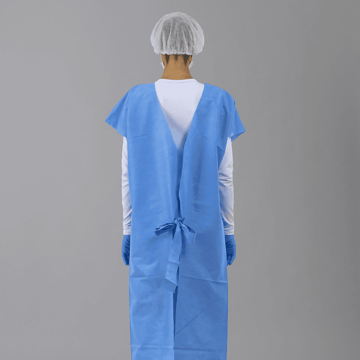 Avental SS 50 gramas para pacientes, sem manga. Camisola TNT azul.